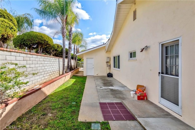 view of yard featuring a patio area and fence