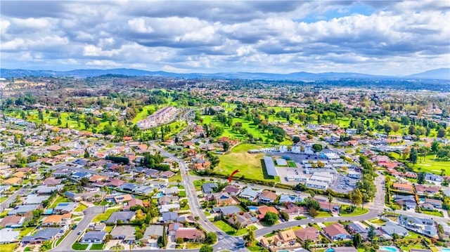 birds eye view of property with a residential view and a mountain view