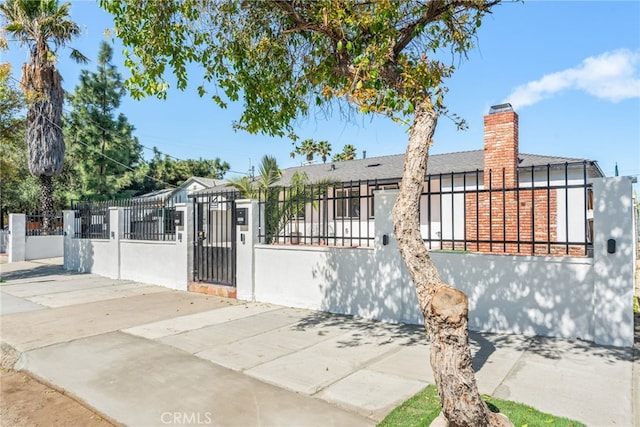 view of gate featuring a fenced front yard