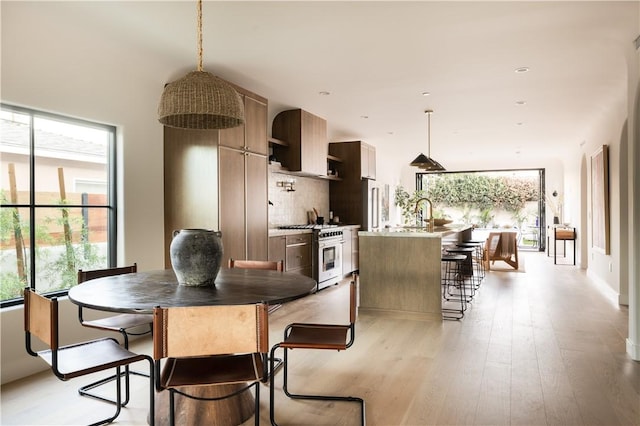 dining area with light wood-type flooring