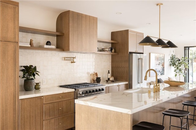 kitchen with decorative backsplash, high quality fridge, a breakfast bar area, light stone countertops, and open shelves