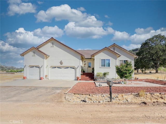 view of front of property with an attached garage and driveway