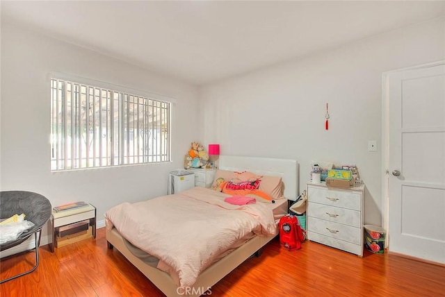 bedroom featuring wood finished floors