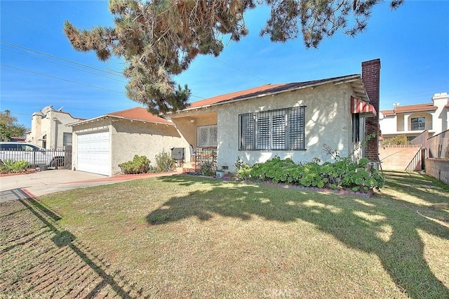 view of front of home featuring a garage, concrete driveway, fence, a front lawn, and stucco siding