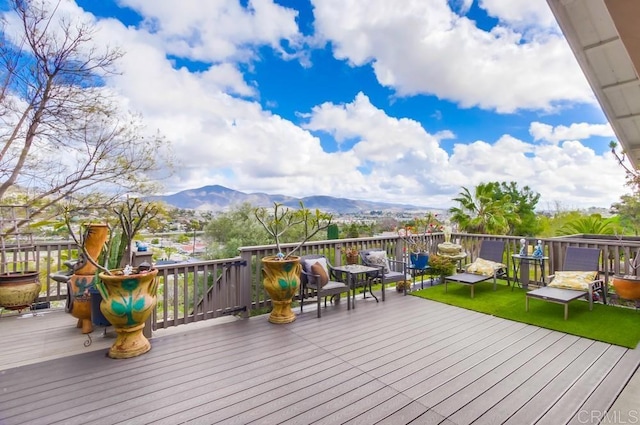 wooden terrace featuring a mountain view