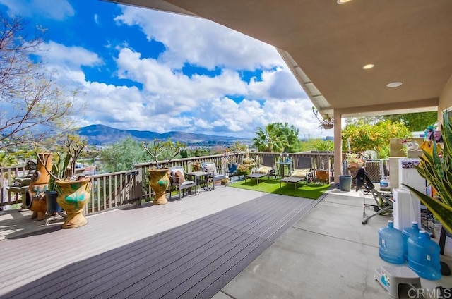 wooden deck featuring a mountain view