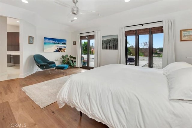 bedroom with baseboards, a ceiling fan, wood finished floors, access to exterior, and recessed lighting