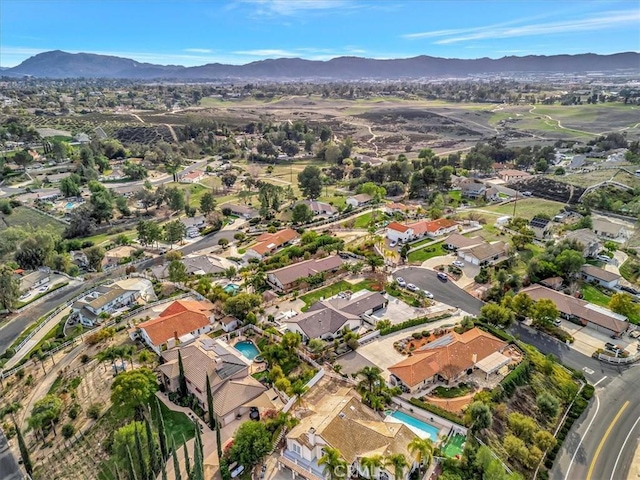 drone / aerial view with a residential view and a mountain view