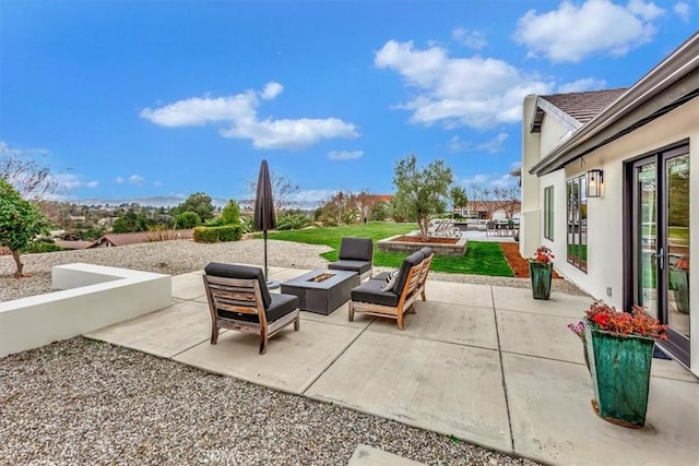 view of patio / terrace with an outdoor fire pit