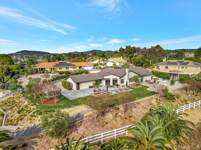 birds eye view of property featuring a mountain view and a residential view