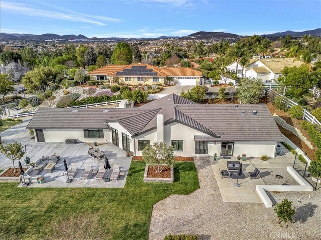 drone / aerial view featuring a mountain view