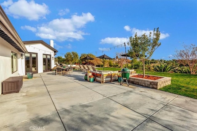 view of patio with french doors and outdoor dining area