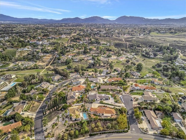 drone / aerial view featuring a residential view and a mountain view