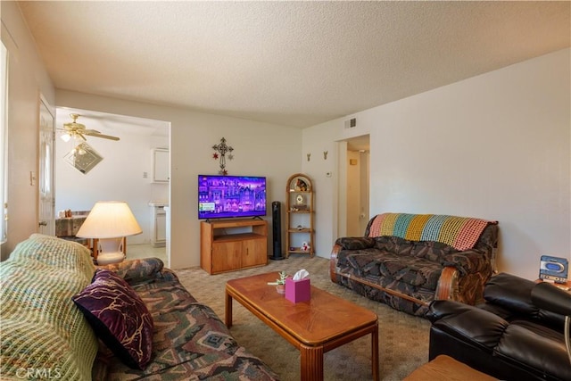 3648 Mira Pacific Dr, Oceanside, CA 92056 - carpeted living room featuring visible vents, ceiling fan, and a textured ceiling