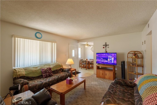 3648 Mira Pacific Dr, Oceanside, CA 92056 - living area featuring a textured ceiling, ceiling fan, and carpet flooring