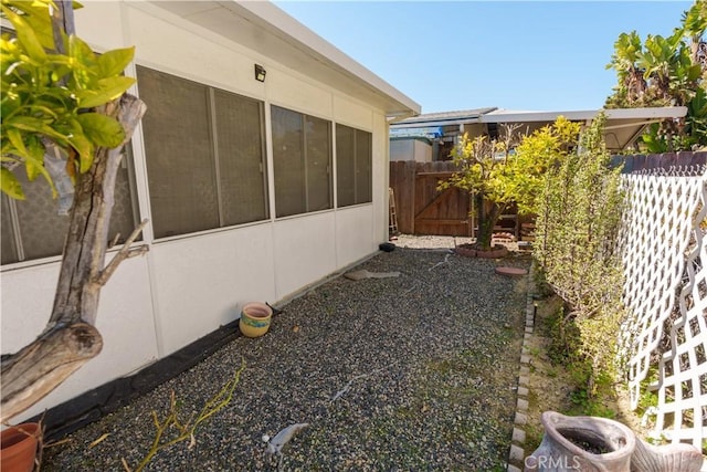 3648 Mira Pacific Dr, Oceanside, CA 92056 - view of home's exterior with a sunroom and fence