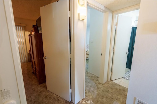 3648 Mira Pacific Dr, Oceanside, CA 92056 - hallway featuring visible vents and light colored carpet