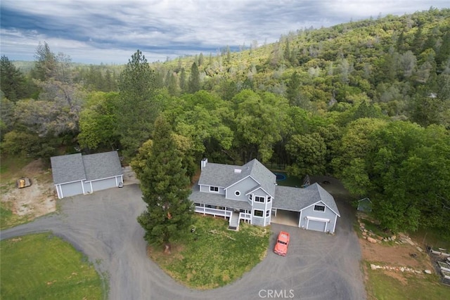 aerial view featuring a wooded view