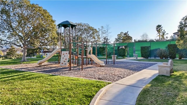 community play area with a lawn