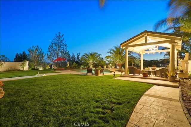 view of yard featuring a gazebo and an outdoor pool