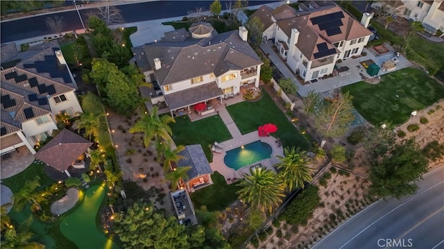 birds eye view of property with a residential view