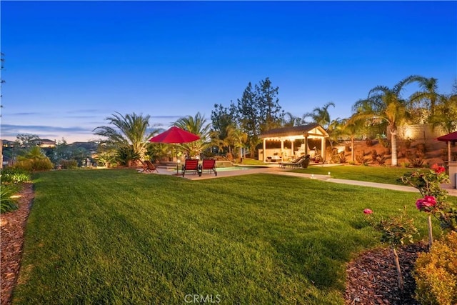 view of yard featuring a gazebo and a patio area