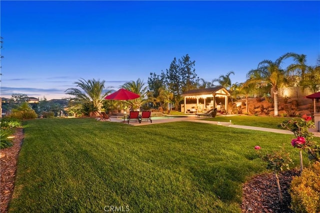 12364 Palmer Dr, Moorpark, CA 93021 - yard at dusk with a gazebo and a patio area