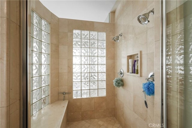 full bath with a tile shower