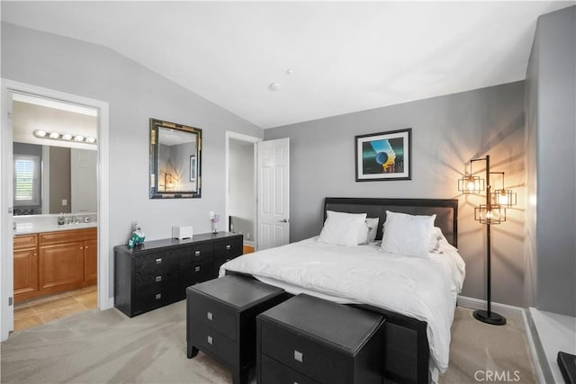 12364 Palmer Dr, Moorpark, CA 93021 - bedroom with baseboards, ensuite bathroom, light carpet, and lofted ceiling