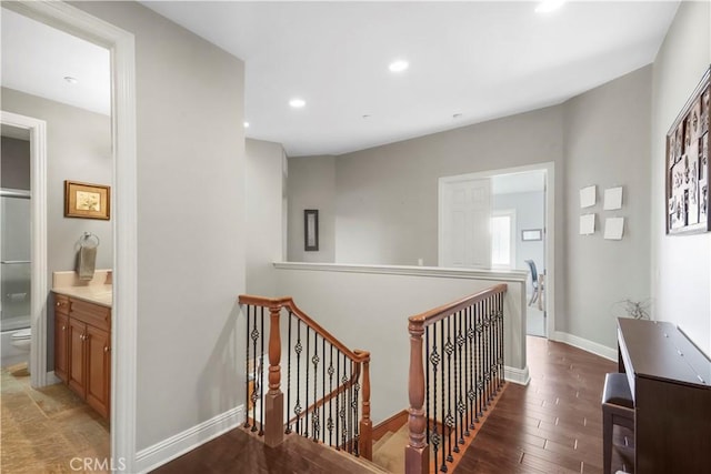 12364 Palmer Dr, Moorpark, CA 93021 - hallway with recessed lighting, baseboards, wood finished floors, and an upstairs landing