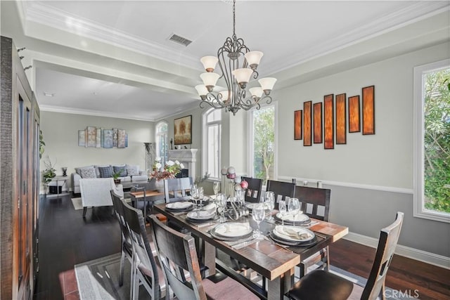 12364 Palmer Dr, Moorpark, CA 93021 - dining space with crown molding, visible vents, wood finished floors, and a chandelier