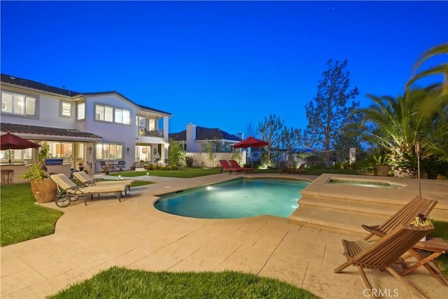 12364 Palmer Dr, Moorpark, CA 93021 - pool at twilight featuring a patio, an outdoor bar, an outdoor pool, and an outdoor hot tub