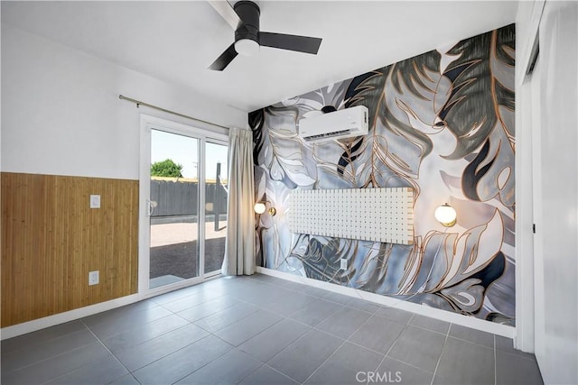 unfurnished room with a wainscoted wall, ceiling fan, wooden walls, and an AC wall unit