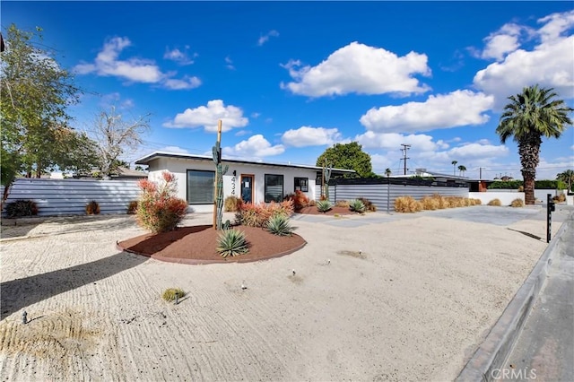 view of front of house featuring fence