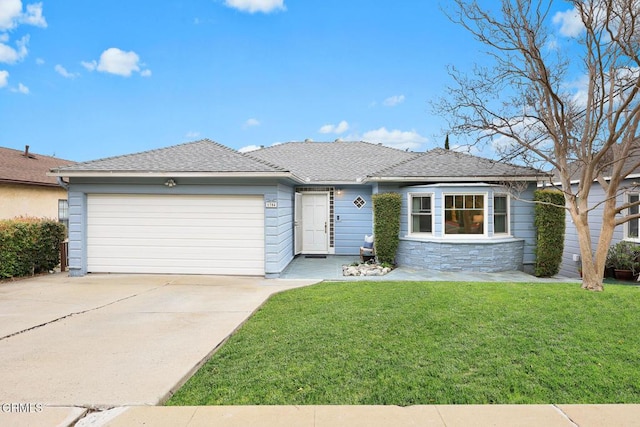 ranch-style house with driveway, a shingled roof, stone siding, an attached garage, and a front yard