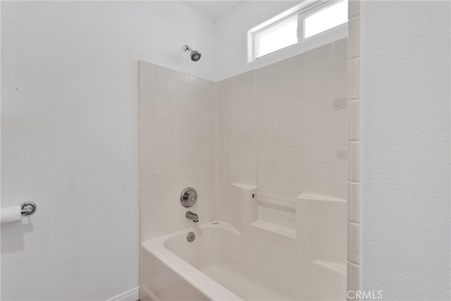 full bathroom featuring shower / bathing tub combination and baseboards