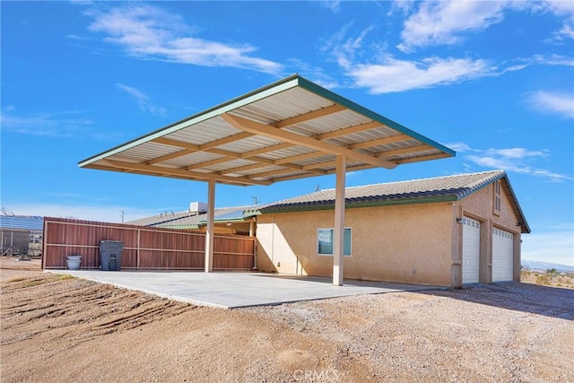 exterior space with a garage and fence