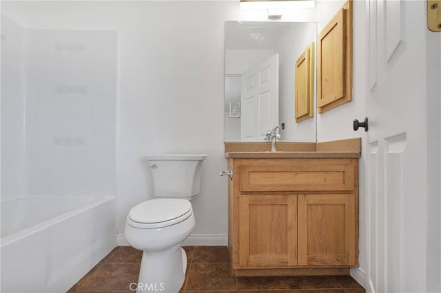 full bath featuring baseboards, vanity, toilet, and tile patterned floors