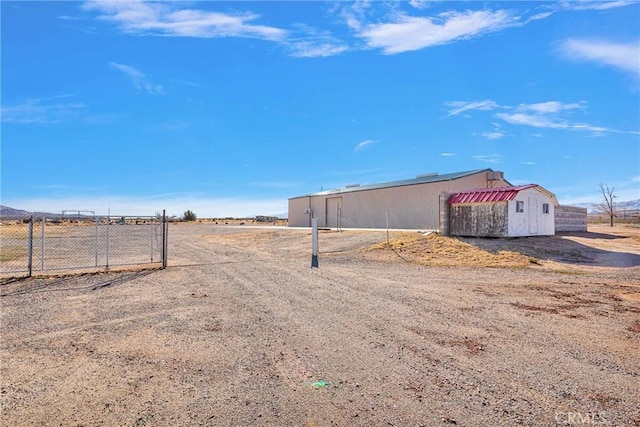 view of yard with an outbuilding and fence