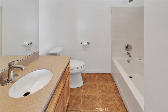 full bathroom with toilet, vanity, baseboards, tub / shower combination, and tile patterned floors