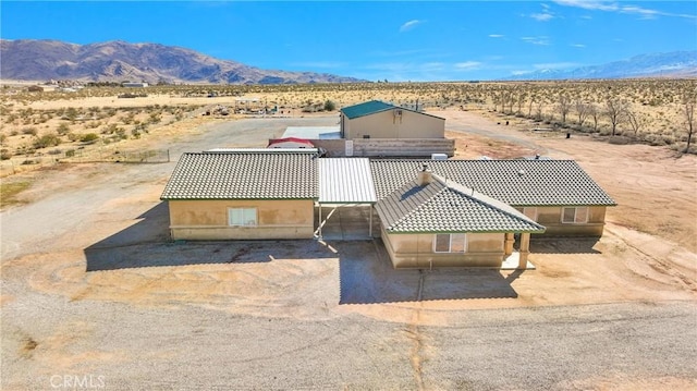 aerial view featuring view of desert and a mountain view