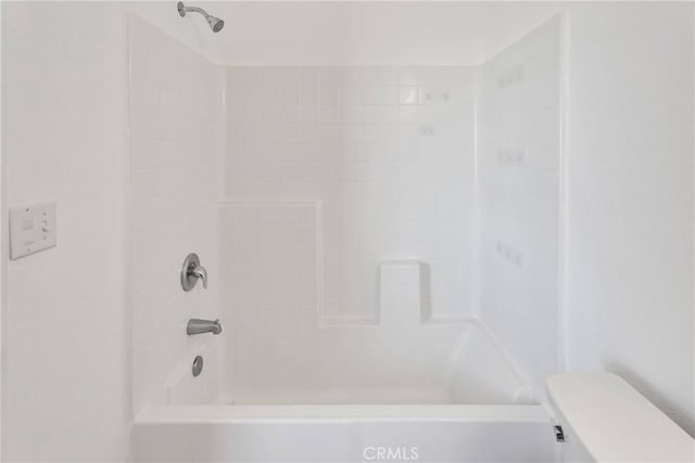 full bathroom featuring tub / shower combination and toilet