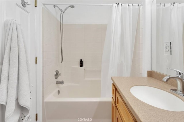 bathroom featuring shower / bath combo with shower curtain and vanity