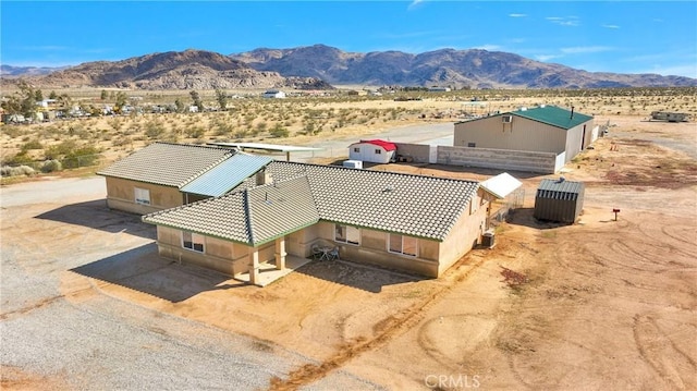 bird's eye view featuring view of desert and a mountain view