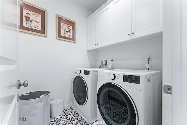 clothes washing area featuring cabinet space, baseboards, separate washer and dryer, and tile patterned floors