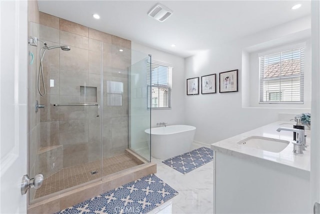 full bath featuring recessed lighting, a sink, visible vents, a freestanding bath, and a stall shower