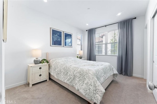 bedroom featuring recessed lighting, light carpet, and baseboards