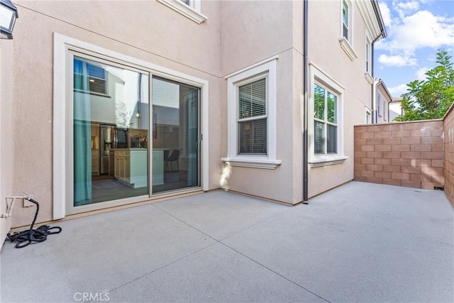 view of patio / terrace featuring fence