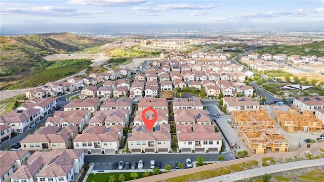 birds eye view of property with a residential view