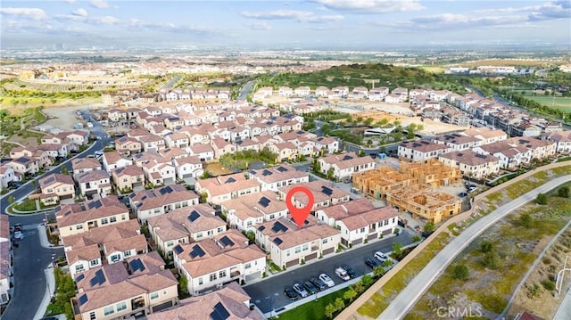 birds eye view of property with a residential view